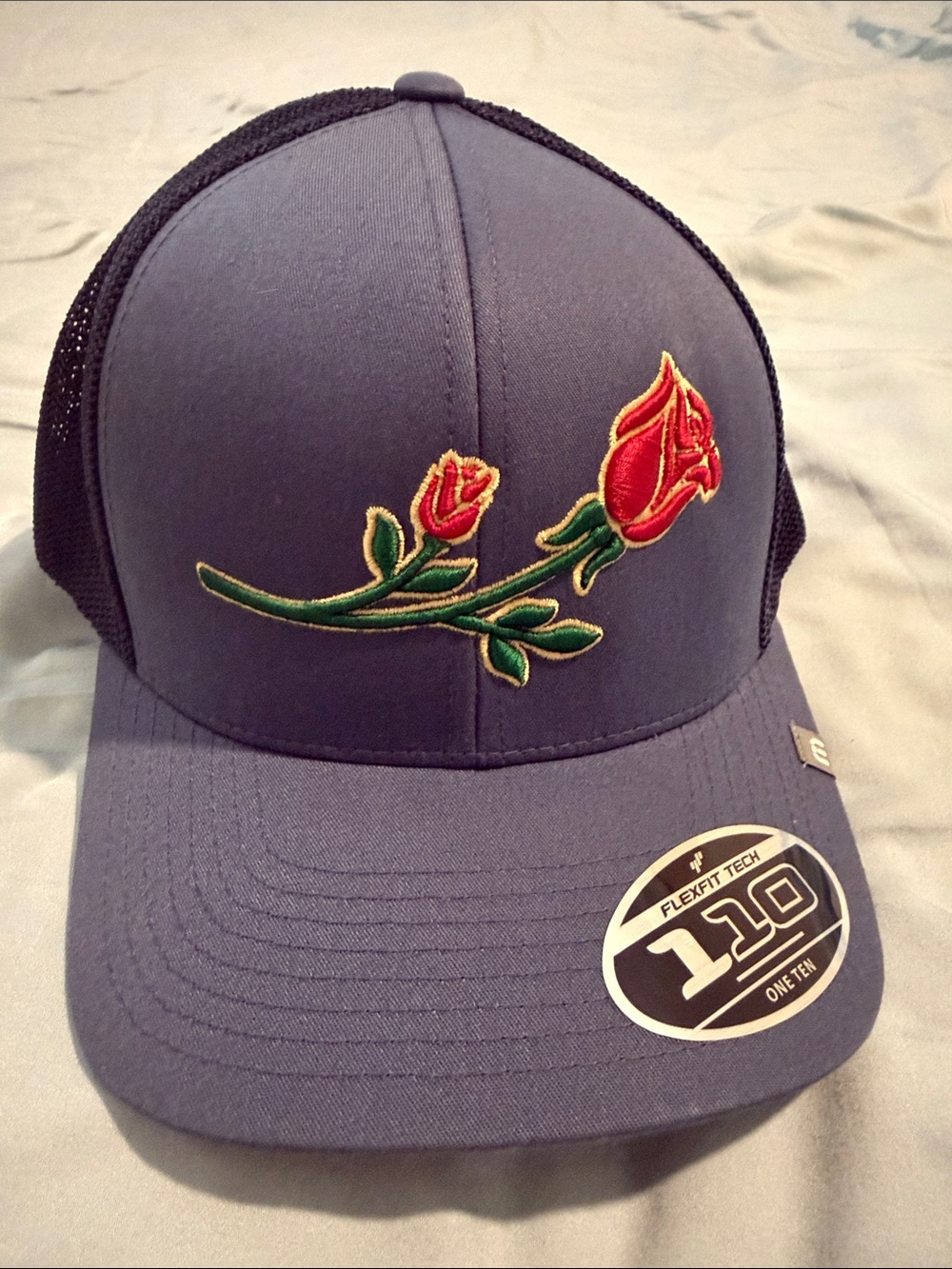 Travis Matthew Trucker Hat with Embroidered Red Rose